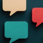 graphic of speech bubbles in bright colours on a dark teal background
