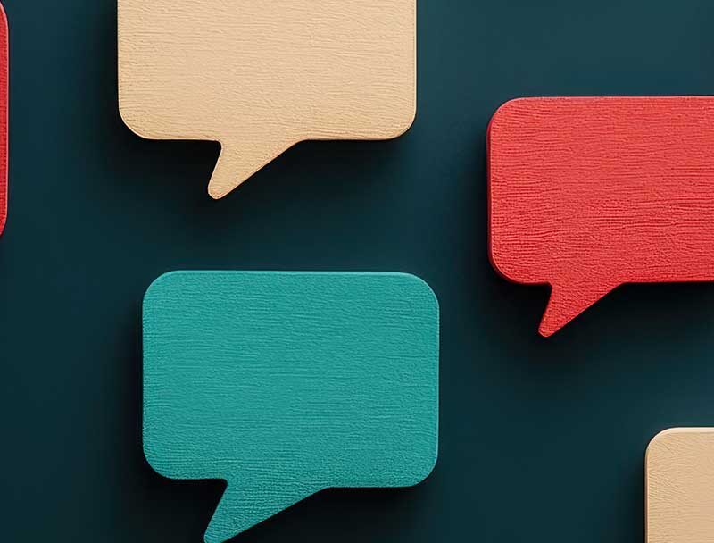 graphic of speech bubbles in bright colours on a dark teal background